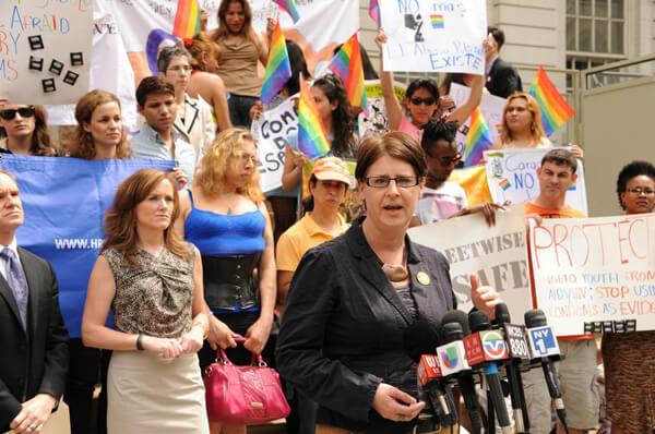 Nassau County District Attorney Kathleen Rice (l.) looks on as Sharon Stapel, executive director of the New York City Anti-Violence Project, addresses the crowd. | DONNA ACETO
