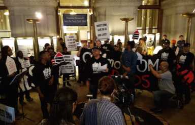 OSBORNE-albany-protest-reading-names-IS