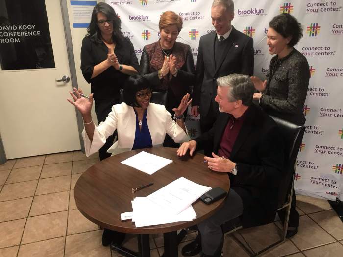 Debbie Brennan, then-president of Brooklyn Community Pride Center’s board of directors, and BFC Partners principal Don Capoccia sign a 30-year flanked by Wendy Stark, Christine Quinn, Floyd Rumohr, and Rachel Loeb in February of 2020.