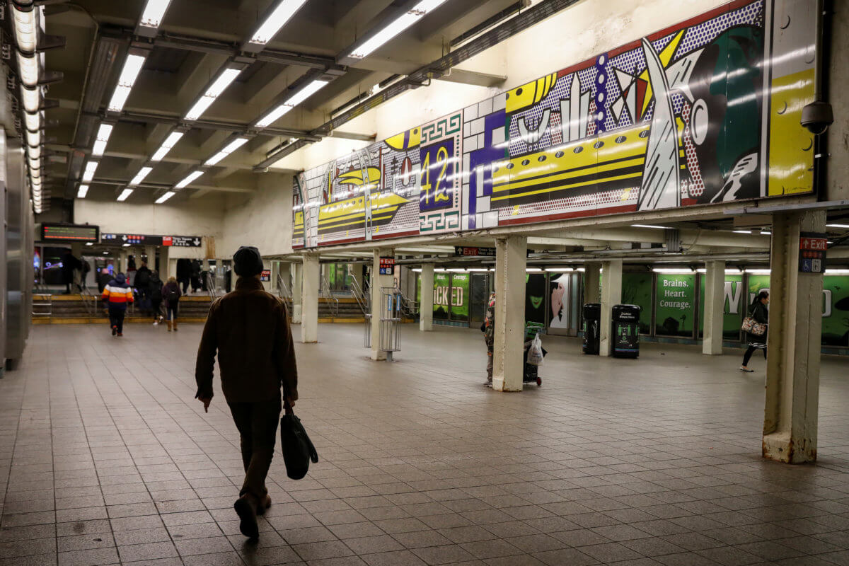 A man walks through a nearly empty Times Square – 42nd St. subway station during the morning rush in New York