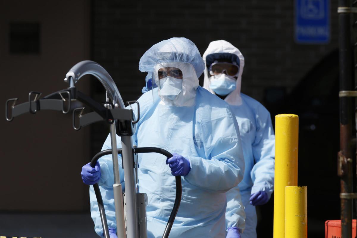 Workers in protective equipment outside Wyckoff Heights Medical Center in Brooklyn during outbreak of the coronavirus disease (COVID-19) in New York