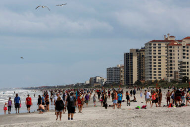 People take advantage of a beach opening for physical activity amid coronavirus disease restrictions in Jacksonville