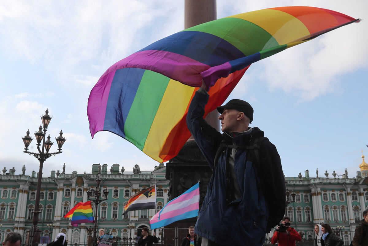 Participant waves rainbow flag during the LGBT community rally “X St.Petersburg Pride” in Saint Petersburg