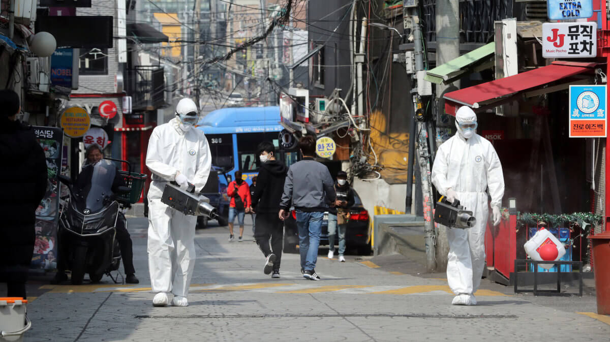 Quarantine workers spray disinfectants at night spots of Itaewon neighborhood, following the coronavirus disease (COVID-19) outbreak, in Seoul