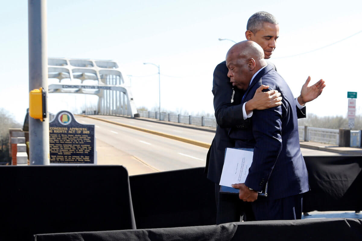 FILE PHOTO: Obama embraces Lewis before their remarks at the Edmund Pettus Bridge in Selma, Alabama