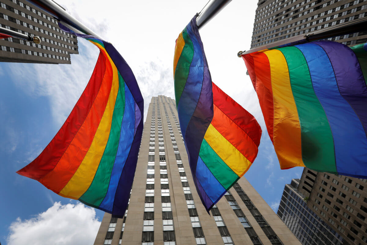 Rainbow flags fly at Rockefeller Center in midtown Manhattan in support of the LGBT community in New York