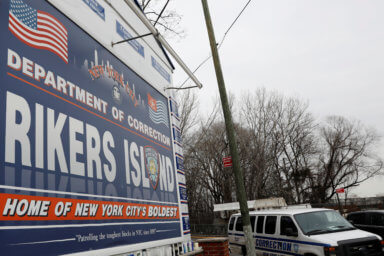 An NYC Department of Corrections vehicle leaves the Rikers Island facility in Queens, in New York