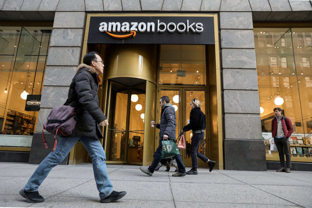 People walk past an Amazon Books retail store in New York