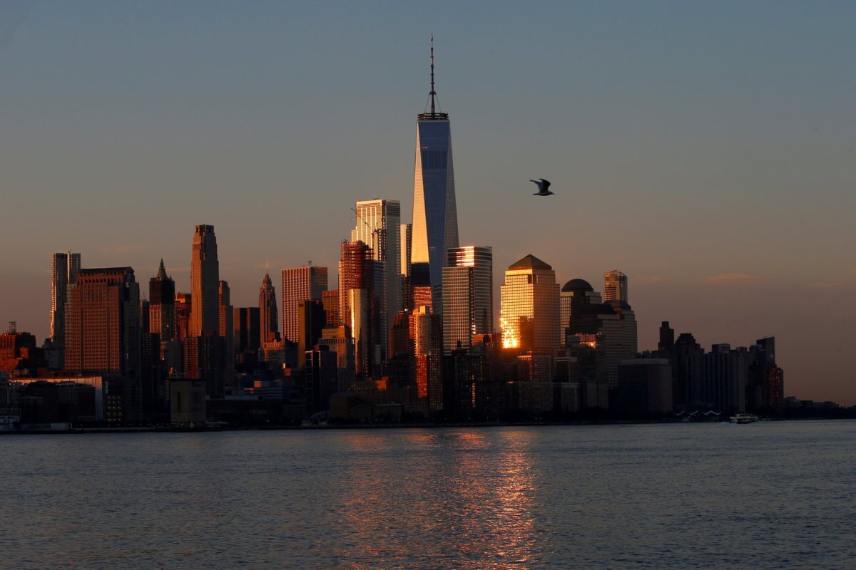 FILE PHOTO: A view of the One World Trade Centre tower and the lower Manhattan skyline of New York City at sunrise as seen from Hoboken