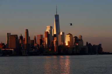 FILE PHOTO: A view of the One World Trade Centre tower and the lower Manhattan skyline of New York City at sunrise as seen from Hoboken