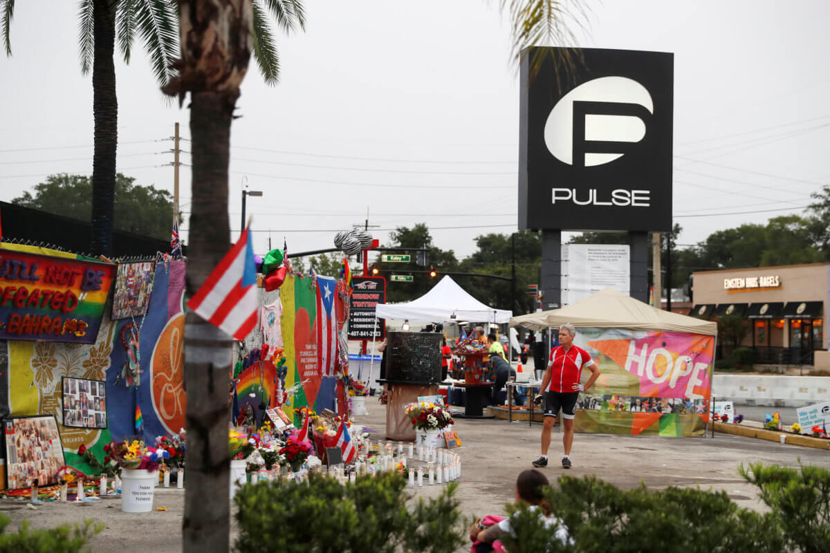 A guest strolls through the parking lot outside the Pulse Nightclub on the one year anniversary of the shooting, in Orlando, Florida