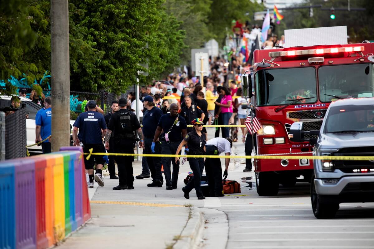 Police and firefighters respond after a truck drove into a crowd of people during The Stonewall Pride Parade and Street Festival in Wilton Manors