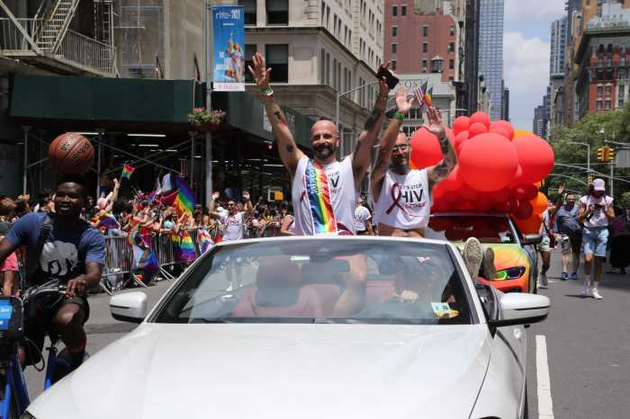 Grand Marshal Demetre Daskalakis gestures to the crowd at the 2021 NYC Pride March.