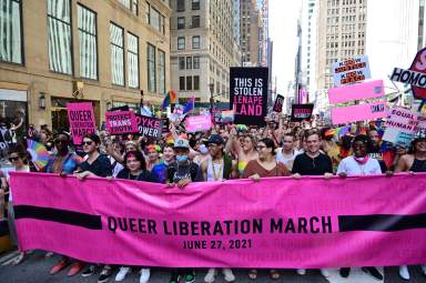 Marchers pack in behind the Reclaim Pride Coalition's Queer Liberation March banner.