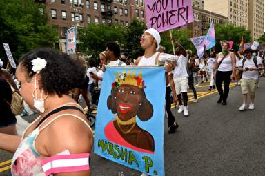 A sign pays tribute to Marsha P. Johnson.