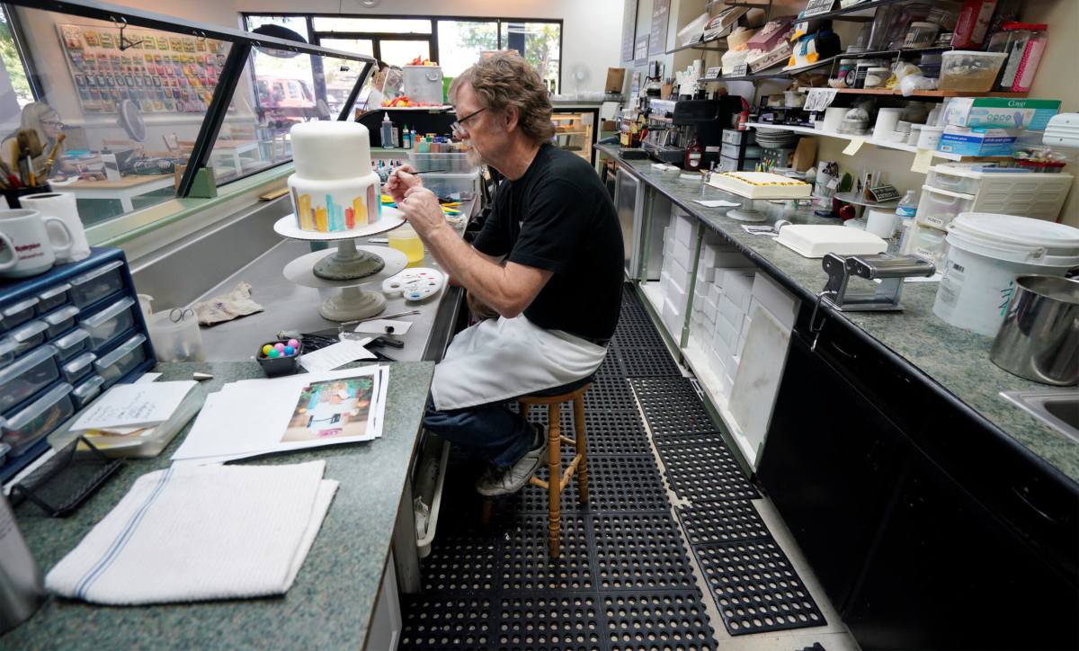 Baker Jack Phillips decorates a cake in his Masterpiece Cakeshop in Lakewood