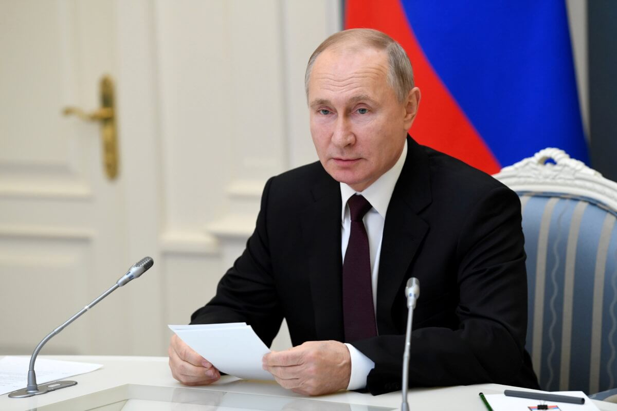 FILE PHOTO: Russian President Vladimir Putin attends a meeting on AstraZeneca and Gamaleya Institute memorandum of intent on cooperation