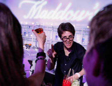 TV host Rachel Maddow tends bar at the MSNBC after-party following the annual White House Correspondents’ Association dinner in Washington
