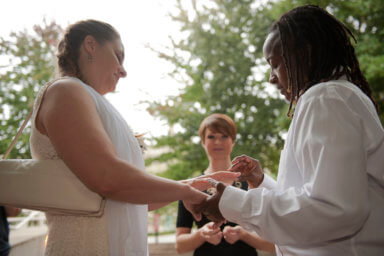 Kathy Stewart places a ring on the finger of her partner, Vicky Mangus, during a wedding ceremony outside of the Mecklenburg County Register of Deeds office in Charlotte
