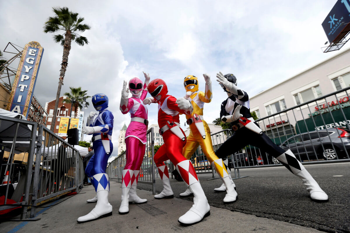 People dressed like the characters of Power Rangers pose at the unveiling of the star for Israeli-American producer Haim Saban on the Hollywood Walk of Fame in Los Angeles