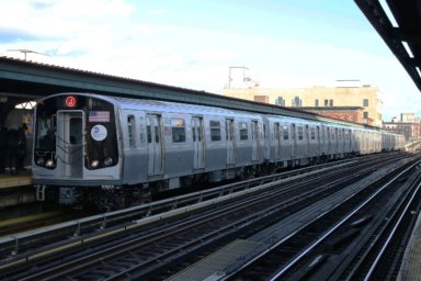 2560px-MTA_NYC_Subway_J_train_arriving_at_Flushing_Ave