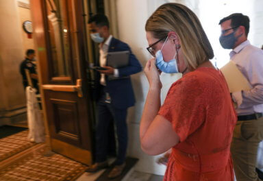 Senator Kyrsten Sinema arrives on Capitol Hill in Washington