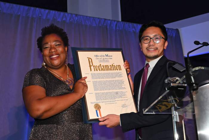 Beverly Tillery receives a proclamation from Patrick Kwan of the Mayor’s office during AVP's 40th anniversary event in 2021.