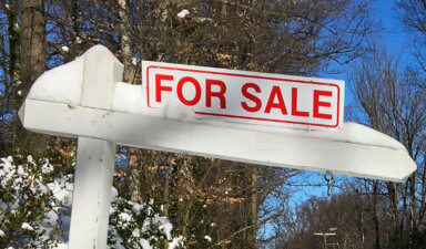FILE PHOTO: A house-for-sale sign inside the Washington DC Beltway in Annandale Virginia