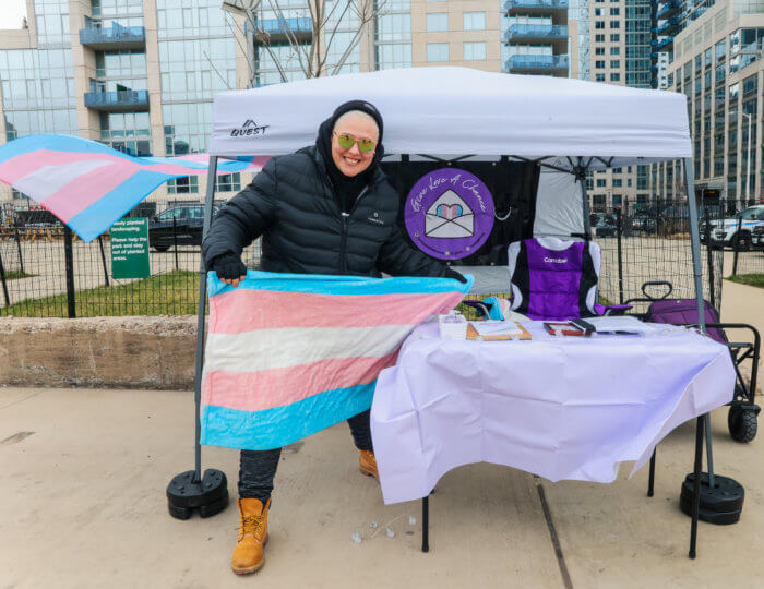 Ness Star holds the Trans Flag at the 2022 Transgender Day of Visibility event at Marsha P. Johnson State Park.