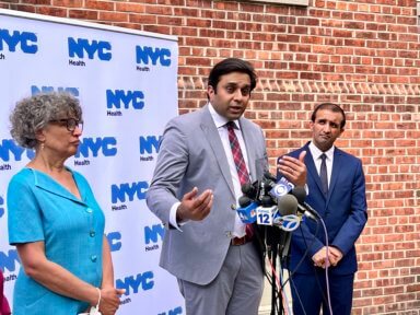 City Health Commissioner Ashwin Vasan speaks alongside former New York State Health Commissioner Mary T. Bassett (left) and Raj Panjabi, then the coordinator of the White House Pandemic Office (right), at an mpox press conference outside of the city's Harlem clinic last year.