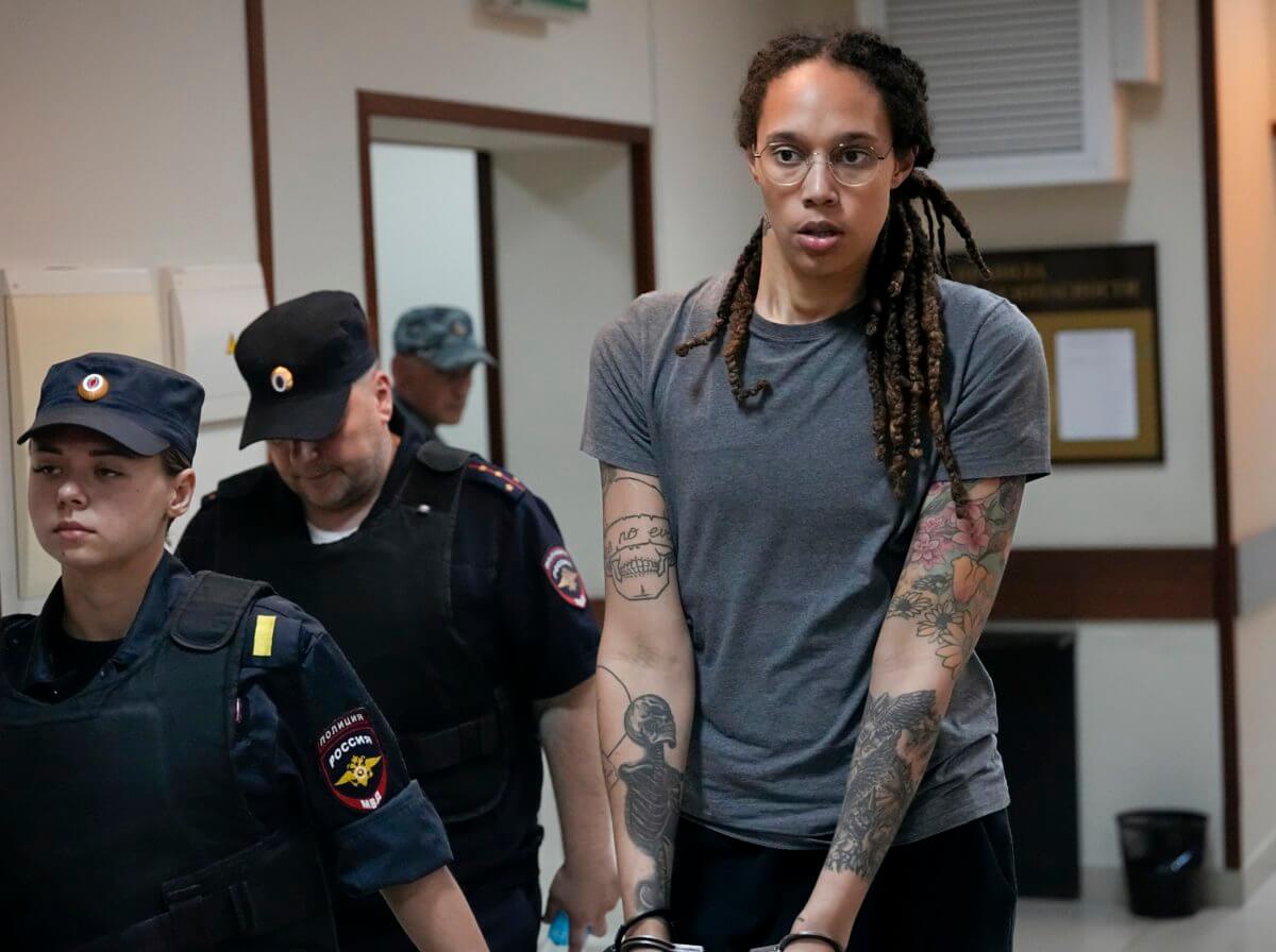 Brittney Griner escorted from a courtroom.