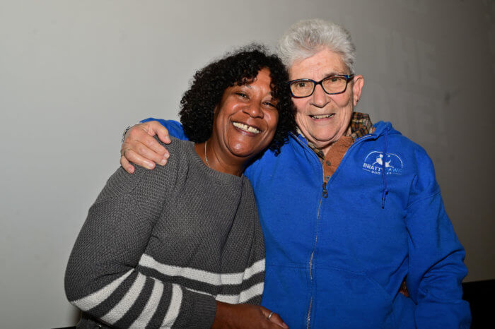 Another activist, Valarie Walker, shares a moment with Esther Newton.