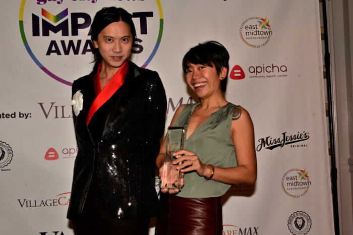 Apicha team accepts an Impact Award