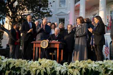 President Joe Biden signs the Respect for Marriage Act on Tuesday, December 13, 2022, on the South Lawn of the White House.