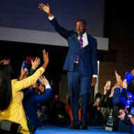 Democratic Senator Raphael Warnock waves to supporters during his election night party.