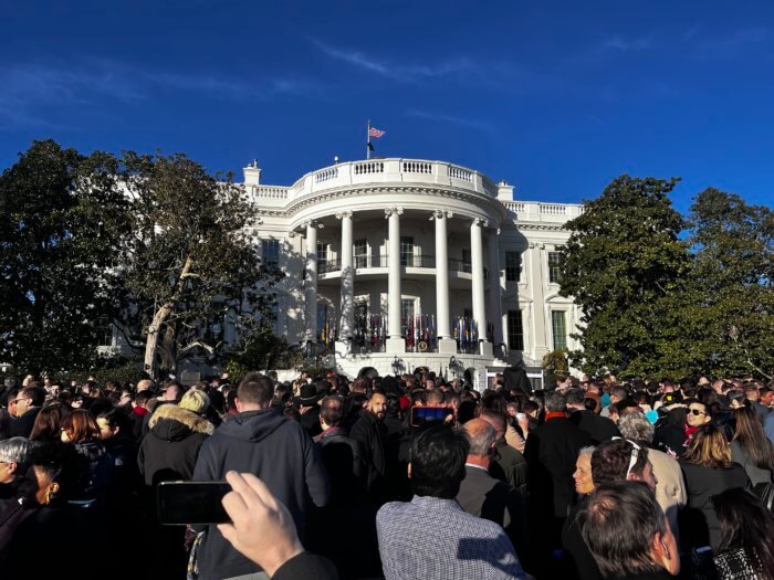 A crowd surrounds the White House in Washington.