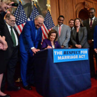 Nancy Pelosi signs the Respect for Marriage Act.