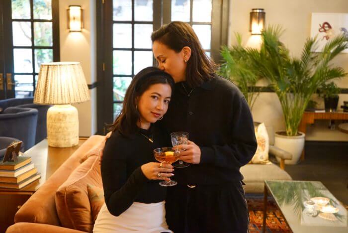 Grotto founder Austa Somvichian-Clausen, left, with her girlfriend, Victoria “Tori” Geddes, right, enjoying cocktails and an intimate moment at the Ludlow House, Grotto’s host, in Manhattan.