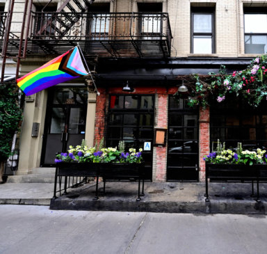 A new Rainbow Flag flies at Little Prince hours after an arsonist set the previous flag on fire.
