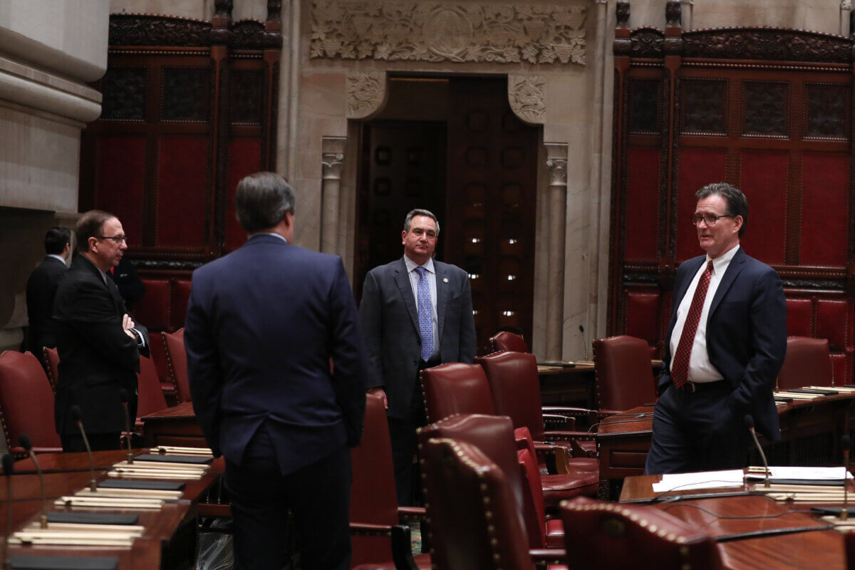 State Senator George Borrello (center) is the lead sponsor of the anti-trans sports bill in the upper chamber.