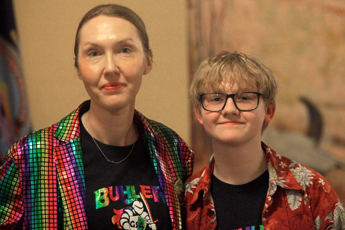 Cat Poland, of Buhler, Kansas, poses with her 13-year-old trans son, Alex, after a day of lobbying by LGBTQ youth and their advocates at the Statehouse, Tuesday, March 28, 2023, in Topeka, Kan. Alex runs cross country and hopes to play baseball next year.