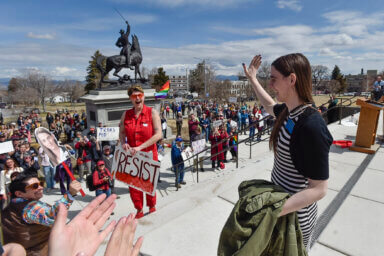 Rep. Zoey Zephyr, D-Missoula, waves to supporters during a rally on the steps of the Montana State Capitol, in Helena, Mont., Monday, April 24, 2023.