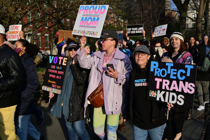 Families and friends march for trans youth.