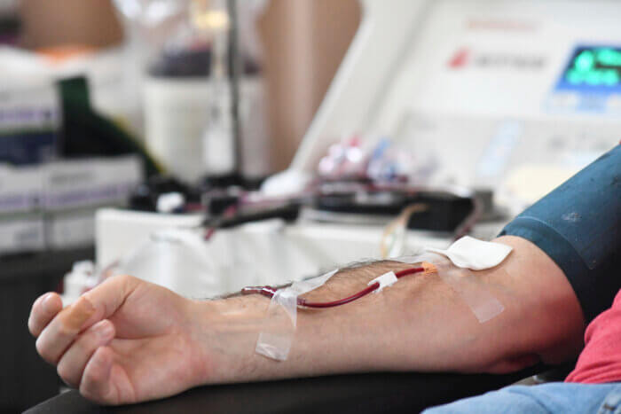 A person donates blood to the American Red Cross during a blood drive in Pottsville, Pa. on Thursday, Jan. 13, 2022.