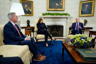 Speaker of the House Kevin McCarthy of Calif., left, and Vice President Kamala Harris listen as President Joe Biden speaks during a meeting with Congressional leaders in the Oval Office of the White House, Tuesday, May 16, 2023, in Washington.