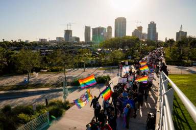 Marchers make their way toward the St. Pete Pier in St. Petersburg, Fla., on March 12, 2022, during a march to protest the controversial "Don't say gay or trans" bill passed by Florida's Republican-led legislature.