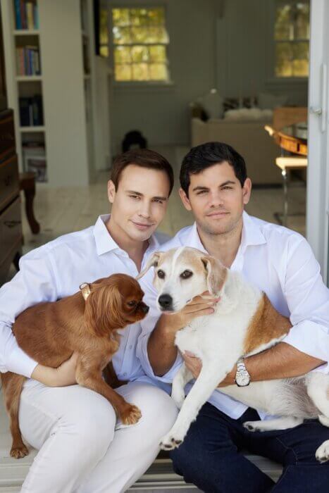 Jared Seligman and Max Schapiro with their dogs, Queen Elizabeth and Winston Churchill.