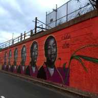 The "Sakia, Sakia, Sakia, Sakia" mural along the McCarter Highway painted by Tatyana Fazlalizadeh in memory of Sakia Gunn in 2016 as a part of the Newark Downtown District’s Gateways to Newark initiative, “Portraits.”