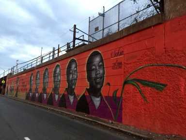 The "Sakia, Sakia, Sakia, Sakia" mural along the McCarter Highway painted by Tatyana Fazlalizadeh in memory of Sakia Gunn in 2016 as a part of the Newark Downtown District’s Gateways to Newark initiative, “Portraits.”