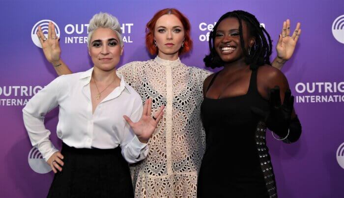 From left to right: Melissa Navia, Jess Bush and Celia Rose Gooding of "Star Trek: Strange New Worlds" give Vulcan greetings on the red carpet during the June 5, 2023 Outright International Courage Awards. 
